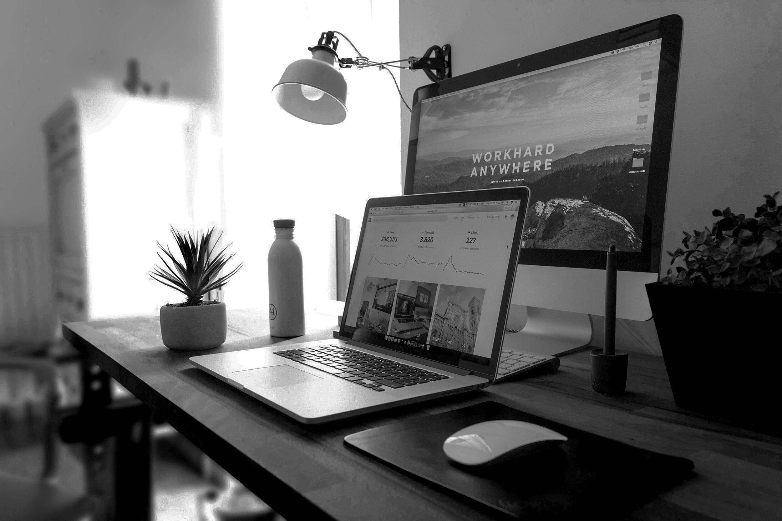Computer and Laptop on Desk