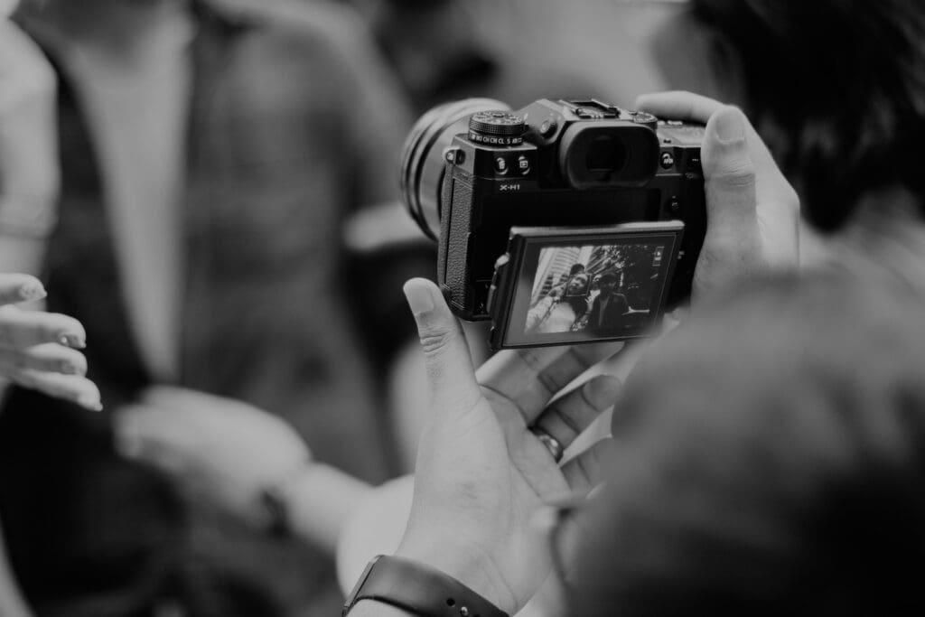 Photo of a camera and two people in the background