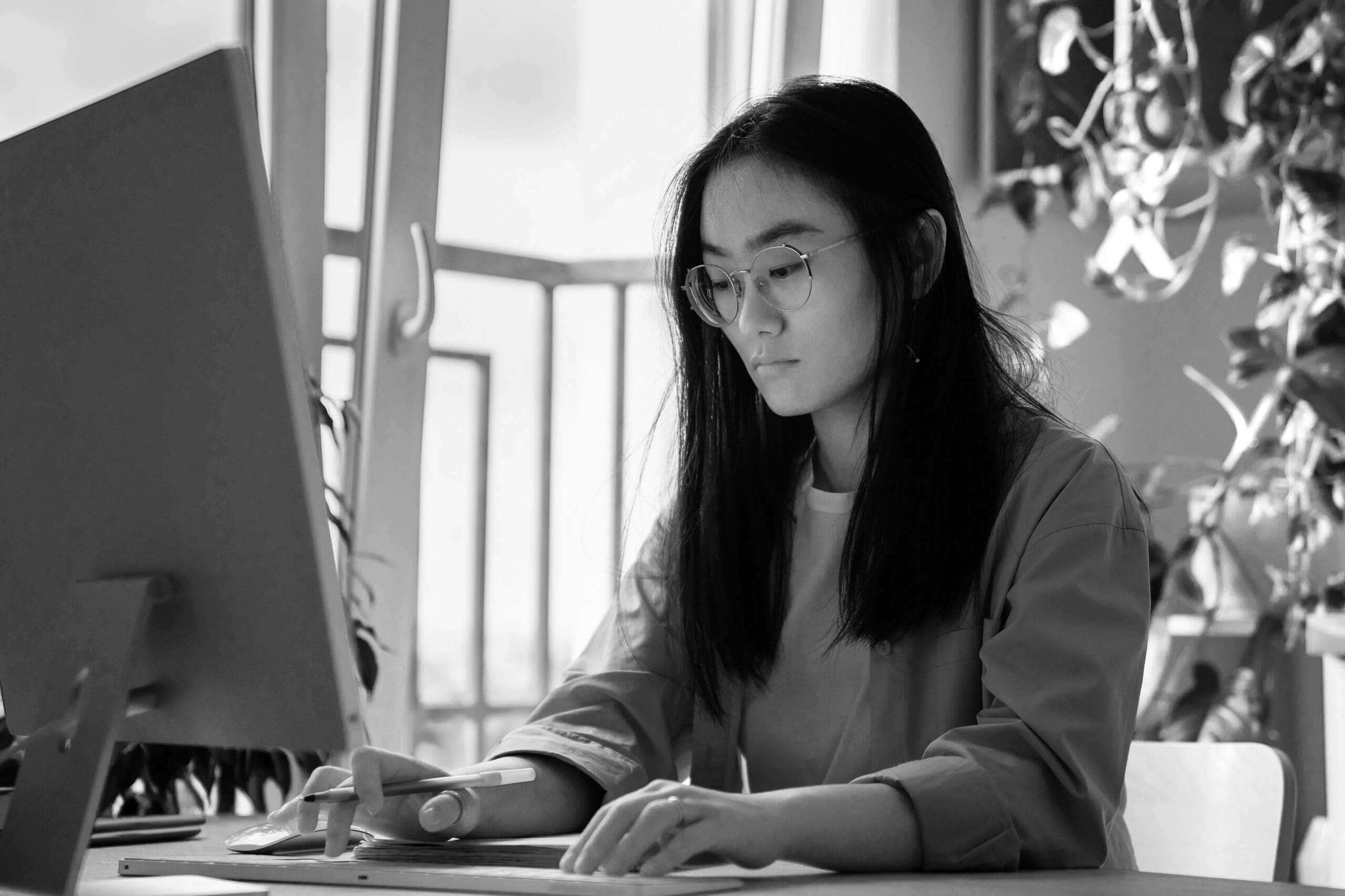 Woman on computer performing local seo keyword research